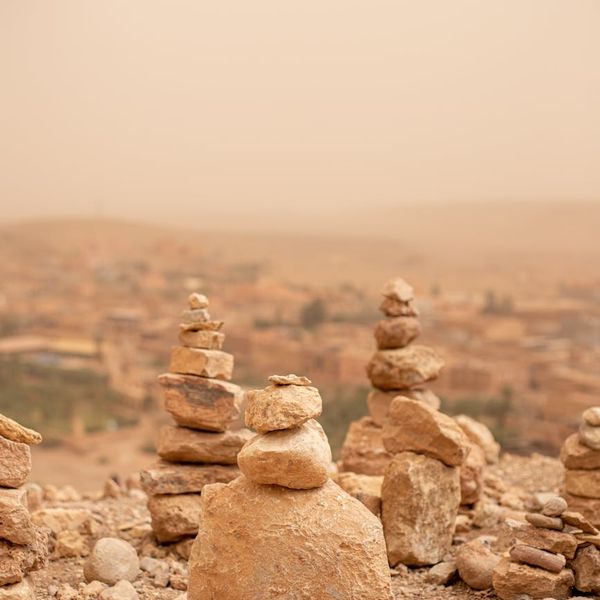A serene natural landscape with stacked stones, symbolizing balance.